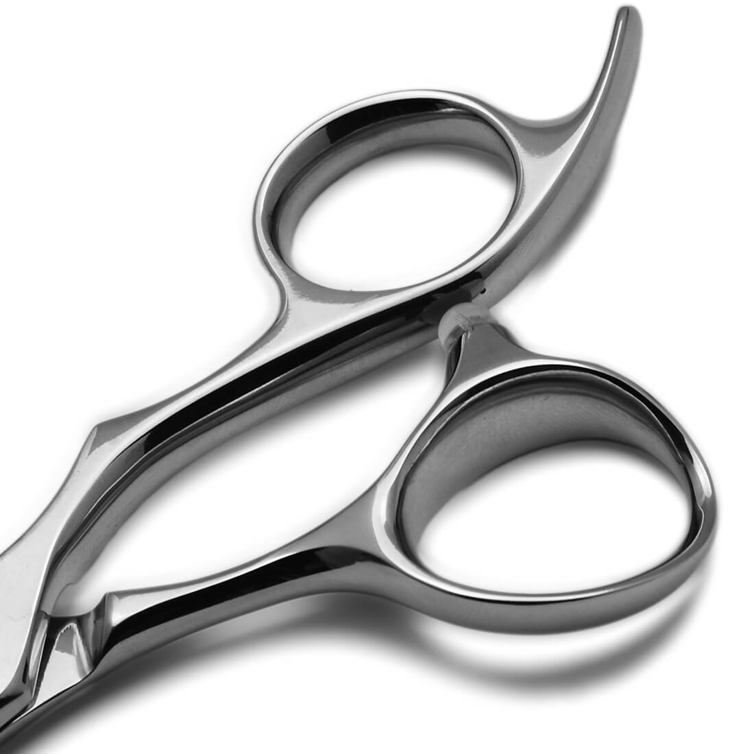 Manche des ciseaux de coiffure japonais KISSEI KI-CRAFTF avec son anneau ergonomique au niveau du pouce du coiffeur