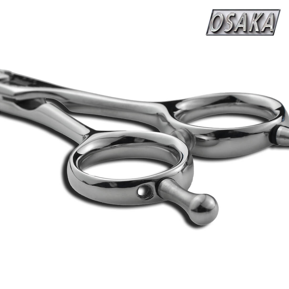 Manche des ciseaux osaka nity avec des anneaux classiques et symétrique et un repose doigt repositionnable.